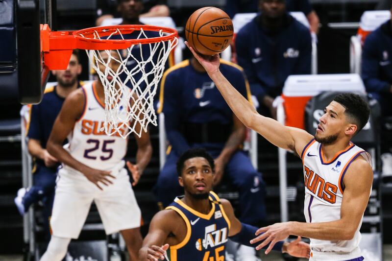 Phoenix Suns guard Devin Booker (1) makes a layup against the Utah Jazz in Salt Lake City on Thursday, Dec. 31, 2020.