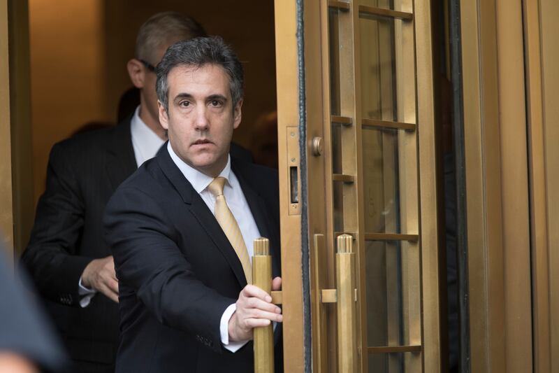 Michael Cohen leaves Federal court, Tuesday, Aug. 21, 2018, in New York. Cohen, has pleaded guilty to charges including campaign finance fraud stemming from hush money payments to porn actress Stormy Daniels and ex-Playboy model Karen McDougal.