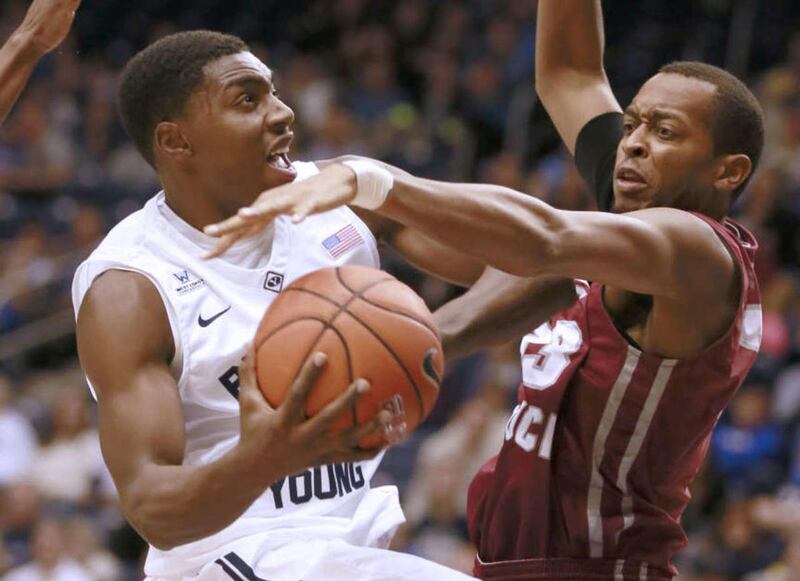 Brigham Young Cougars guard Frank Bartley IV gets fouled by Eastern Kentucky Colonels forward Deverin Muff during the game at the Marriott Center Saturday, Nov. 29, 2014, in Provo.