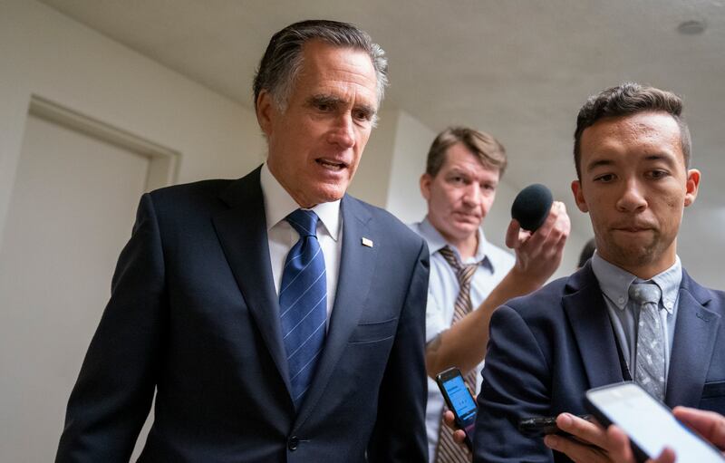 Mitt Romney speaking to reporters