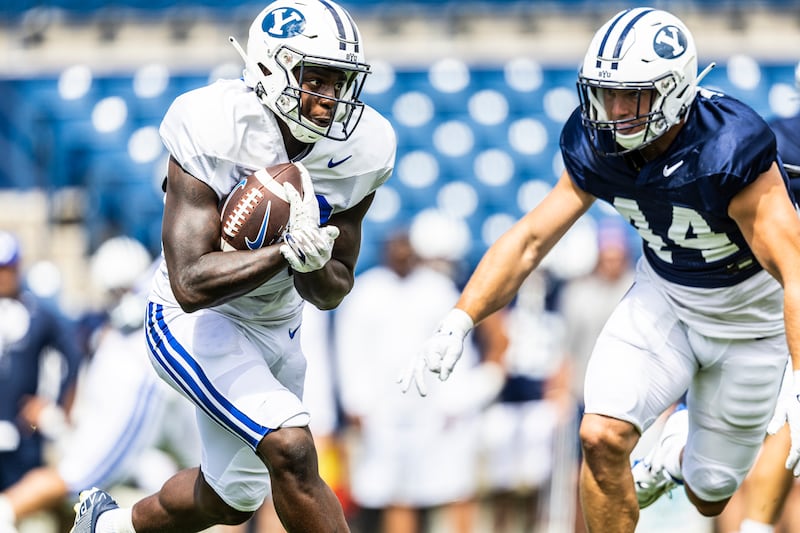 The BYU Cougars football team plays in its first scrimmage of fall camp at LaVell Edwards Stadium on Aug. 13, 2022, in Provo.
