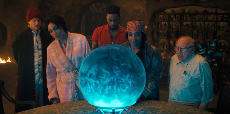 Owen Wilson, Rosario Dawson, LaKeith Stanfield, Tiffany Haddish and Danny DeVito in a scene from “Haunted Mansion.”