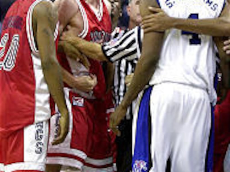 Tempers flare as referees and teammates hold back Gonzaga's Adam Morrison, center, and Memphis' Shawne Williams after a hard foul.