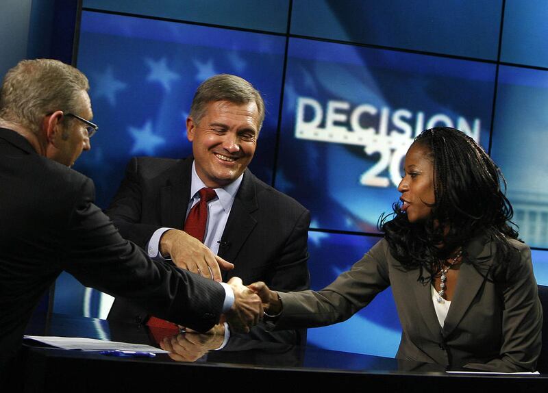 KSL reporter Rich Piatt shakes hands with 4th Congressional District candidates Rep. Jim Matheson and Saratoga Springs Mayor Mia Love after their debate on KSL 5 News in Salt Lake City on Thursday, Sept. 27, 2012. Piatt will join Congresswoman-elect Mia L