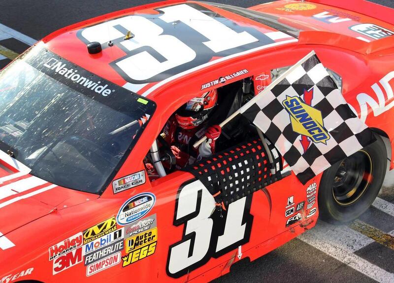 Justin Allgaier celebrates after winning the NASCAR Nationwide auto race Saturday, Aug. 18, 2012 at the Circuit Gilles Villeneuve in Montreal.