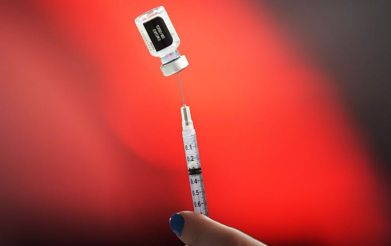 A COVID-19 vaccine is prepared during a Utah County Health clinic.