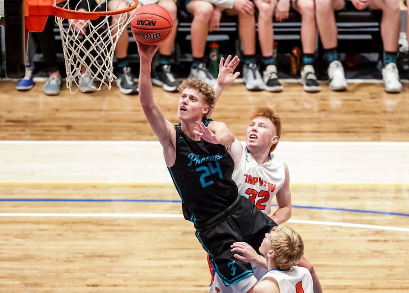Farmington’s Collin Chandler goes to the hoop