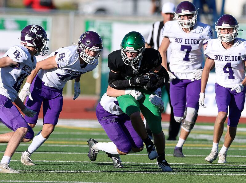 Box Elder High School and Provo High School players play football