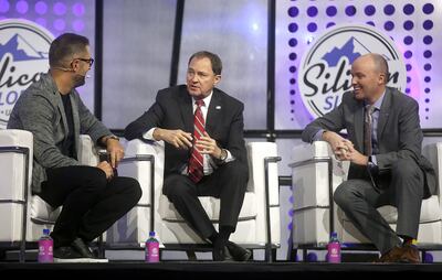 Pluralsight CEO Aaron Skonnard, Gov. Gary Herbert and Lt. Gov. Spencer Cox speak at the Silicon Slopes Tech Summit at the Salt Palace Convention Center in Salt Lake City on Thursday, Jan. 31, 2019.