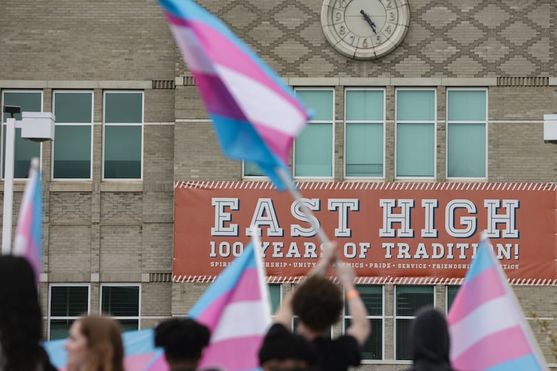 East High School students hold transgender flags during a protest against the Utah Legislature’s passage of HB11 in Salt Lake City on April 15, 2022.