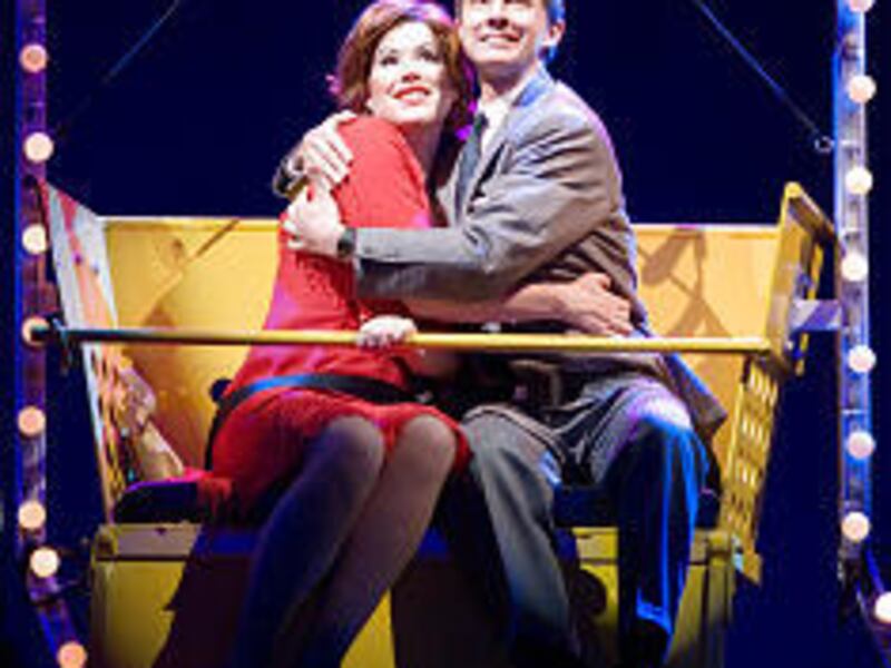 Charity and Oscar (Molly Ringwald and Guy Adkins) embrace on a Coney Island Ferris wheel in "Sweet Charity," a national touring production that's coming to the Capitol Theatre next week.