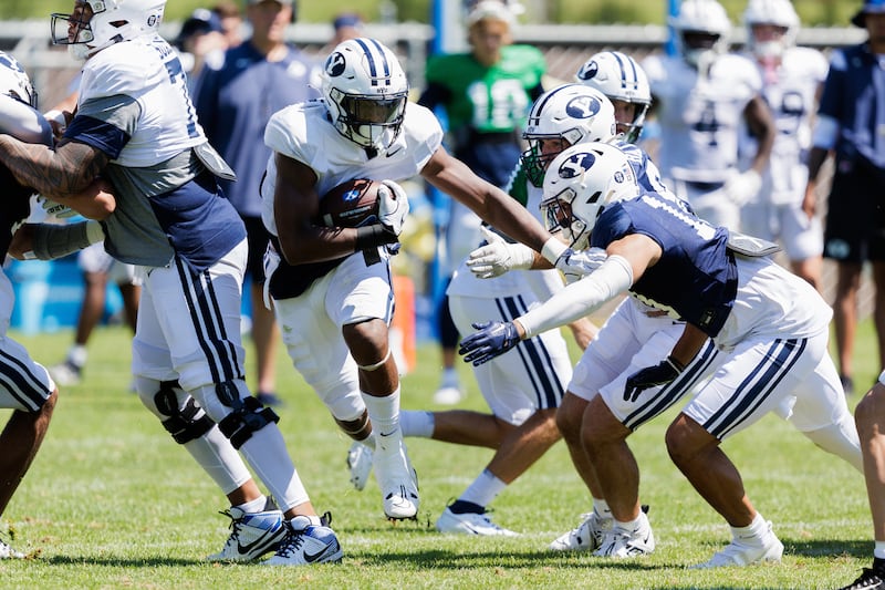 BYU newcomer Aidan Robbins find a hole during practice at BYU’s practice facility.
