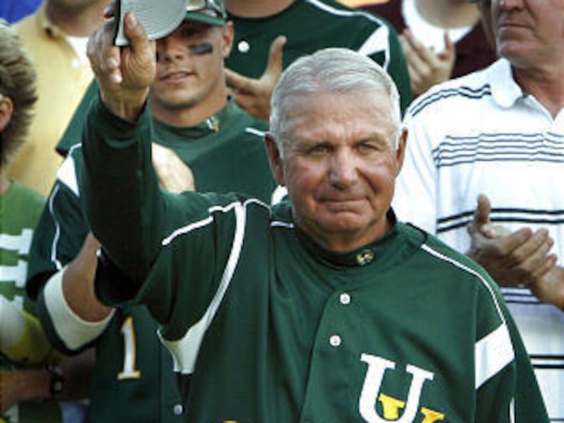 UVSC baseball coach Steve Gardner waves to the crowd as he receives an ovation honoring him before his final game against BYU. He coached the Wolverines for 18 years.