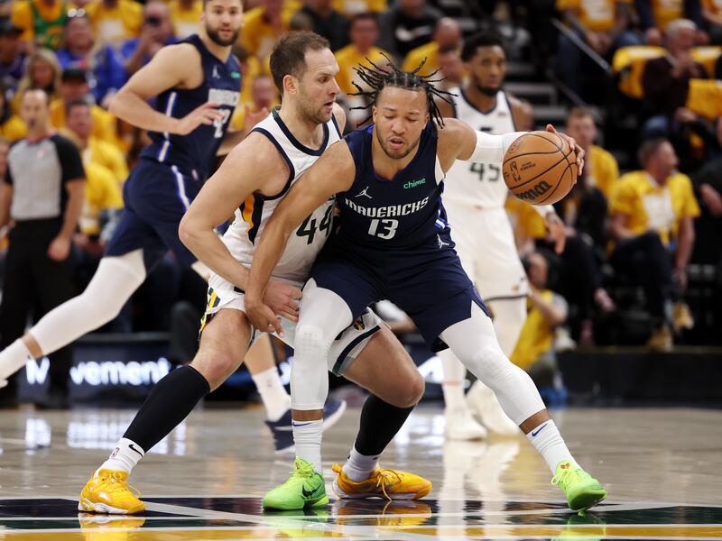 Utah Jazz forward Bojan Bogdanovic, wearing white, defends Dallas Mavericks guard Jalen Brunson