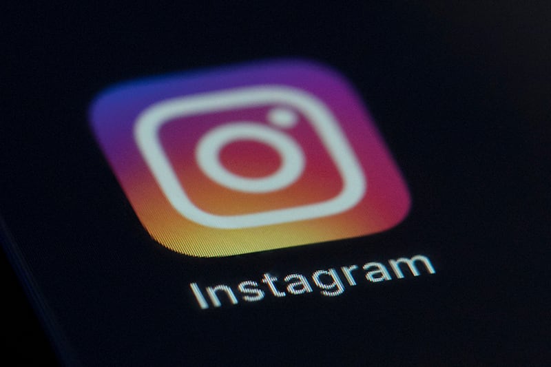 This Friday, Aug. 23, 2019 file photo shows the Instagram app icon on the screen of a mobile device in New York. Celebrities including Kim Kardashian West, Katy Perry and Leonardo DiCaprio are taking part in a 24-hour “freeze” Wednesday, Sept. 16, 2020 on Instagram to protest against the failure of the social media platform’s parent company, Facebook, to tackle misinformation and hateful content.