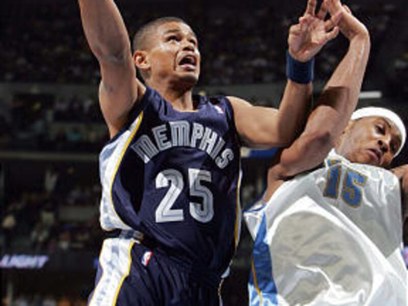 Memphis Grizzlies guard Earl Watson, left, goes up for a shot past Denver Nuggets forward Carmelo Anthony in 2005.