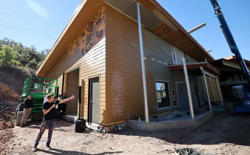 Matt Willey, artist and founder of The Good of the Hive initiative, talks about a bee and pollinator mural he is painting on the new Norma W. Matheson Education Animal Center inside the future Aline W. Skaggs Wild Utah exhibit at the Hogle Zoo in Salt Lake City on Tuesday.