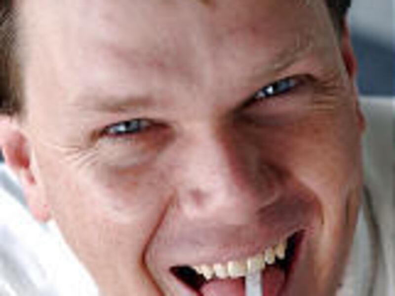 Stephen Wooding, a researcher at U. School of Medicine, uses PTC-soaked paper to test people's taste for bitterness.