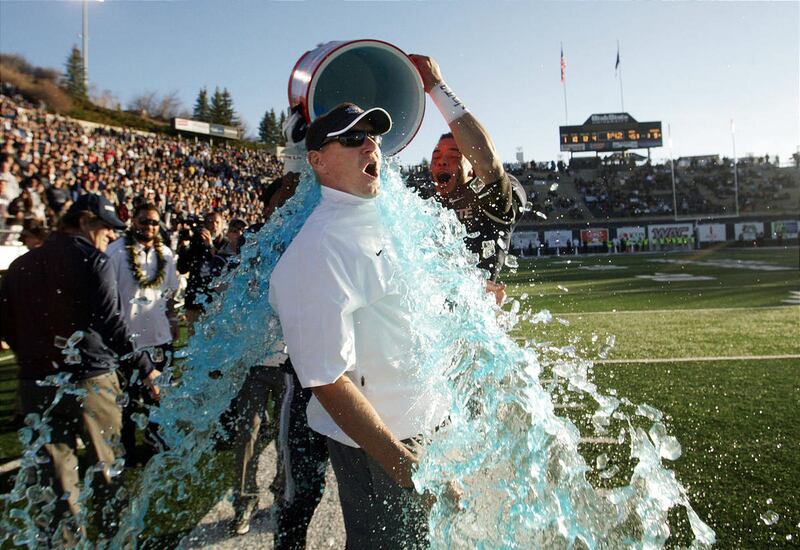 Utah State Aggies head coach Gary Andersen gets doused in Logan after clinching the WAC title.