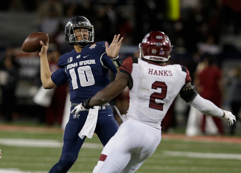 Utah State quarterback Jordan Love (10) in the second half during the Arizona Bowl NCAA college football game against New Mexico State, Friday, Dec. 29, 2017, in Tucson, Ariz. New Mexico State defeated Utah State 26-20 in overtime. (AP Photo/Rick Scuteri)