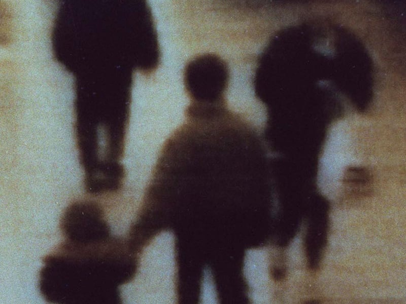 Closed-circuit TV footage shows James Bulger, left, being led away in a shopping mall in Liverpool, England, on Feb. 12, 1993, before he was murdered. Britain's Home Secretary David Blunkett decided, on June 22, 2001, after consultation with the parole bo