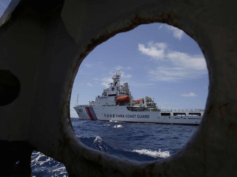 A China Coast Guard vessel attempts to block a Philippine government vessel as the latter tries to enter the China Second Thomas Disputed Shoals (local name Ayungin Shoal) to replace Philippine troops and resupply provisions Saturday, March 29, 2014 off t