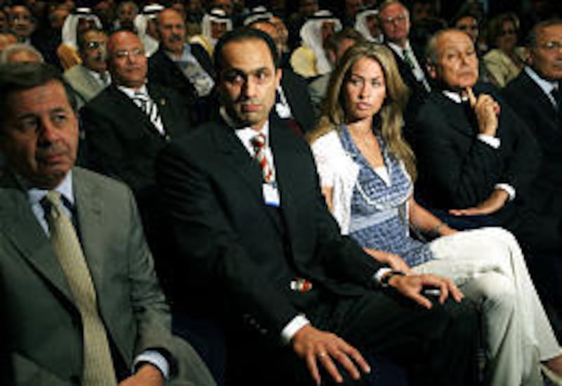 Gamal Mubarak, center, son of Egyptian President Hosni Mubarak, and Khadiga al-Gamale attend a forum in 2006. The couple were married on April 28 at an air force reception hall in Cairo, Egypt.