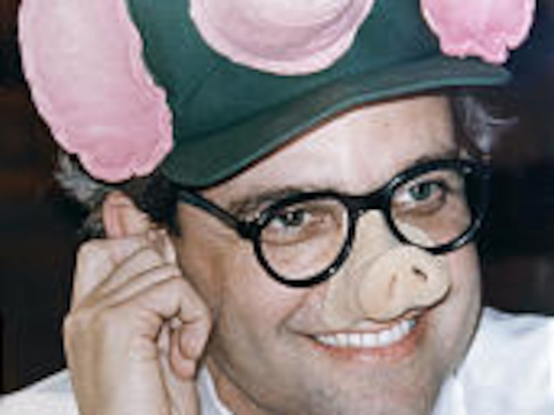 Cincinnati City Council member Arn Bortz wears a flying pig hat and pig nose during a hearing; Cincinnati has often been known as "Porkopolis," thanks to its pork industry.