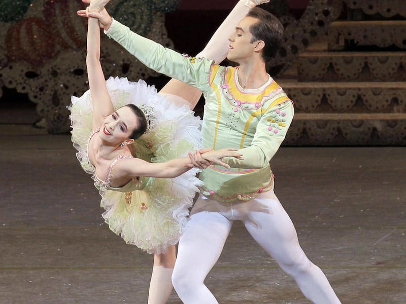 This November 2010 photo courtesy of the New York City Ballet/Paul Kolnik shows Jenifer Ringer, as the Sugar Plum Fairy, left, and Jared Angle, as the Cavalier, during a performance of "The Nutcracker," at Lincoln Center in New York. It's Christmas, and
