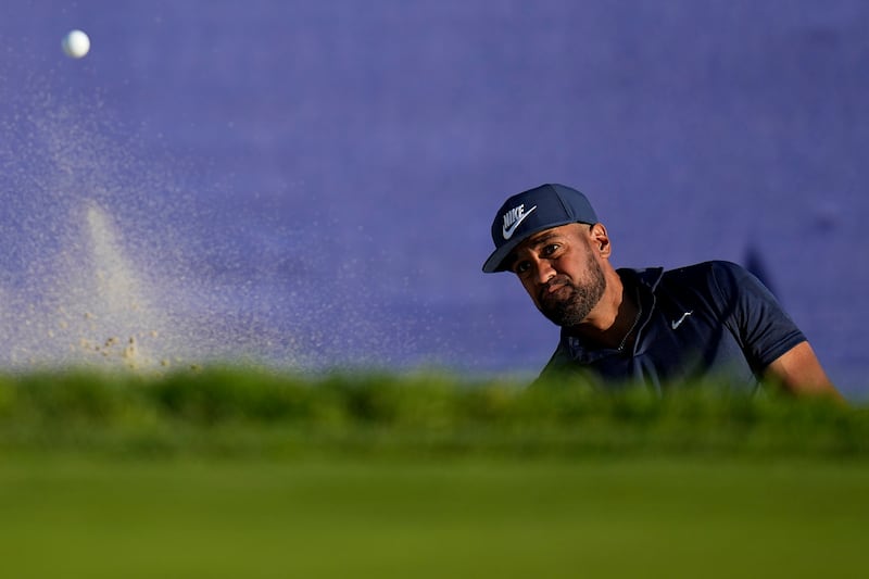 Tony Finau hits out of a bunker on the 18th hole at Torrey Pines during the third round of the Farmers Insurance Open.