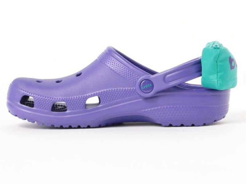 Crocs has teamed up with a Tokyo company called “Beams” to release a pair of their classic Crocs shoes, only the shoes have a little twist: they come with attached pouches like miniature fanny packs.