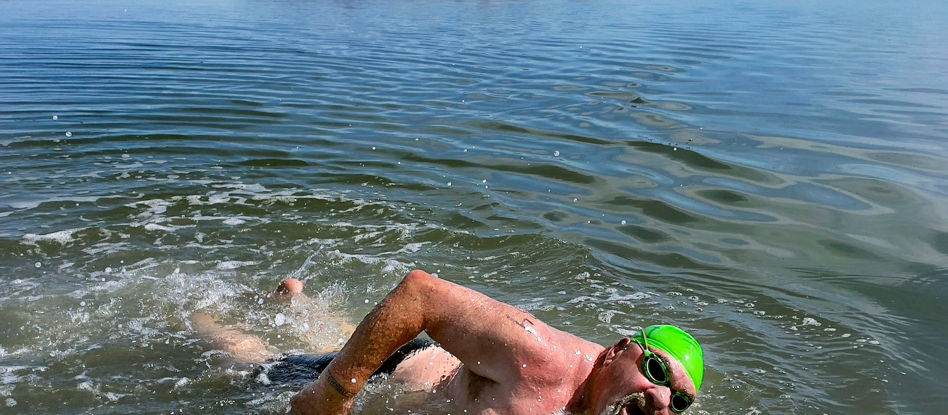 Lane Henderson, of Riverton, competes in a 1-mile open swim competition at Great Salt Lake State Park in Magna.