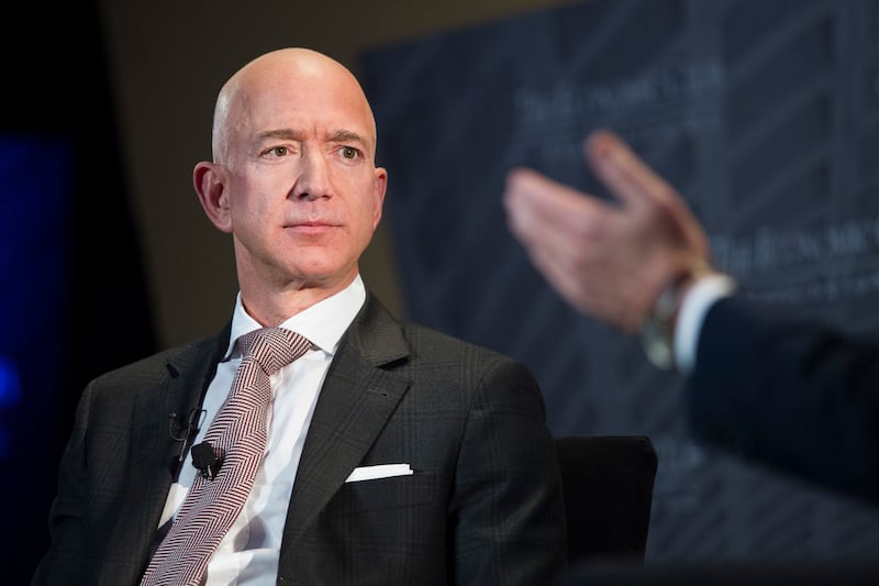FILE - In this Sept. 13, 2018, file photo Jeff Bezos, Amazon founder and CEO, speaks at The Economic Club of Washington's Milestone Celebration in Washington. The Wall Street Journal reports that the National Enquirer's publisher paid $200,000 to obtain i