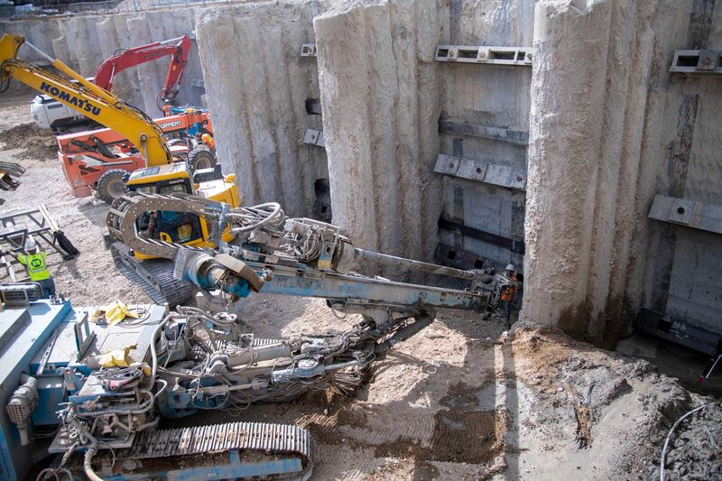 Crews prepare the foundation of the Salt Lake Temple for further excavation.