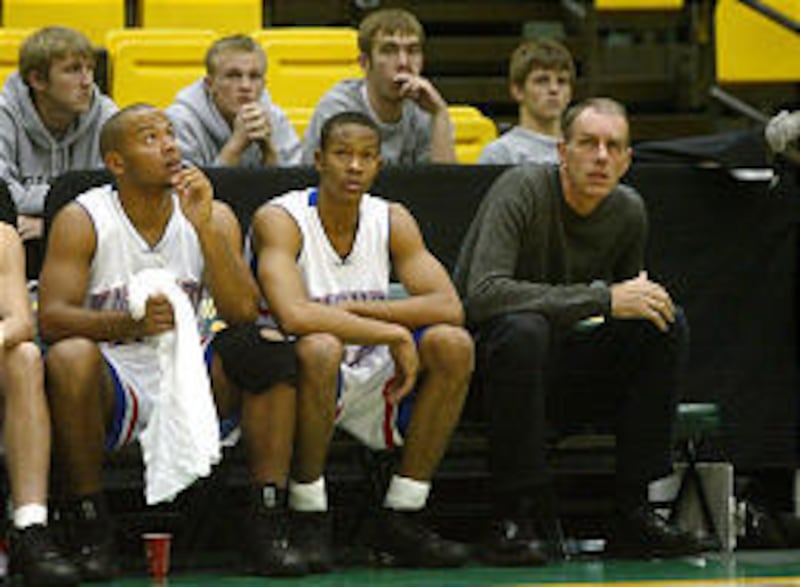 Bobby Jones, far right, a former player for the Philadelphia 76ers and a teammate of NBA legend Julius Erving, sits of the bench at UVSC during the Ragu Basketball Tournament last Friday. Jones is an assistant coach with the Charlotte Christian high schoo