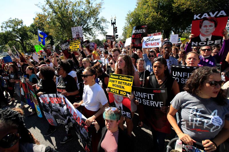 Protesters march toward the Supreme Court as they demonstrate against Supreme Court nominee Brett Kavanaugh in Washington, Thursday, Oct. 4, 2018. (AP Photo/Manuel Balce Ceneta)