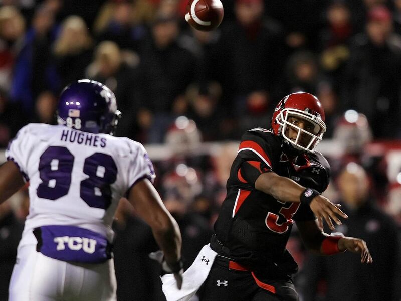 Utah QB Brian Johnson (3) passes past TCU DE Jerry Hughes (98) in the second half of play as Utah and TCU play at Rice Eccles Stadium November 6, 2008 Photo by Scott G. Winterton/Deseret News.