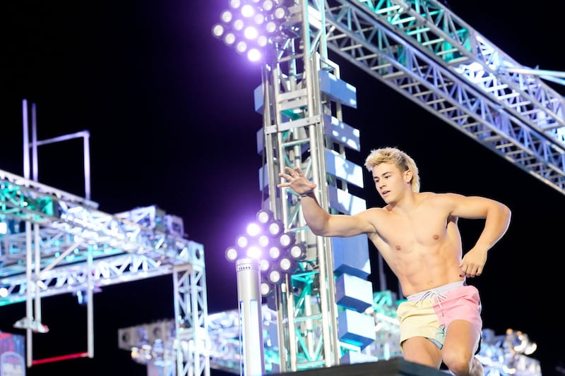 Kai Beckstrand hits the buzzer after one of his races during the finals of "American Ninja Warrior" Season 17.
