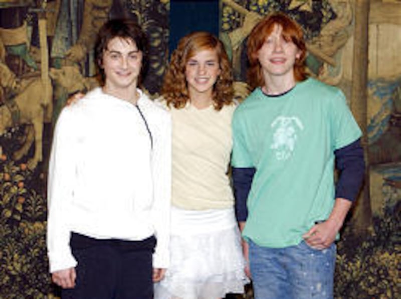 The teenage stars of the the new "Harry Potter and the Prisoner of Azkaban" movie, Daniel Radcliffe, left, Emma Watson and Rupert Grint, appear at a promotion at a London library. The movie opens next week.