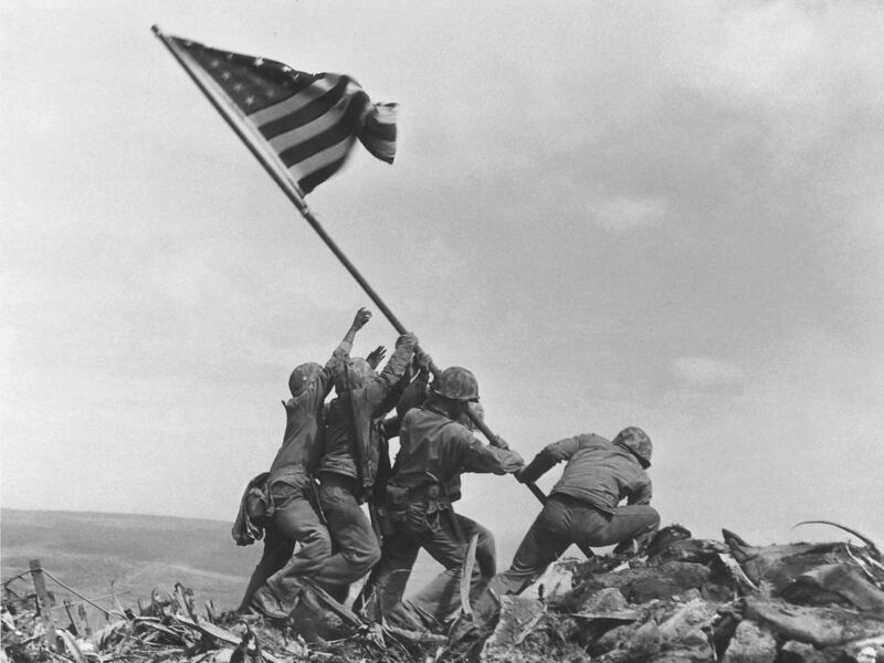 U.S. Marines of the 28th Regiment of the Fifth Division raise the American flag atop Mt. Suribachi, Iwo Jima, in this file photo of Feb. 23, 1945. A search team is on the island of Iwo Jima looking for a cave where the Marine combat photographer who filme