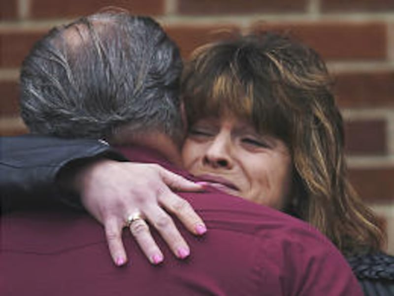 Angela Bryant, right, mother of Jessica Lunsford, 9, hugs a relative before a memorial service for her slain daughter Saturday.