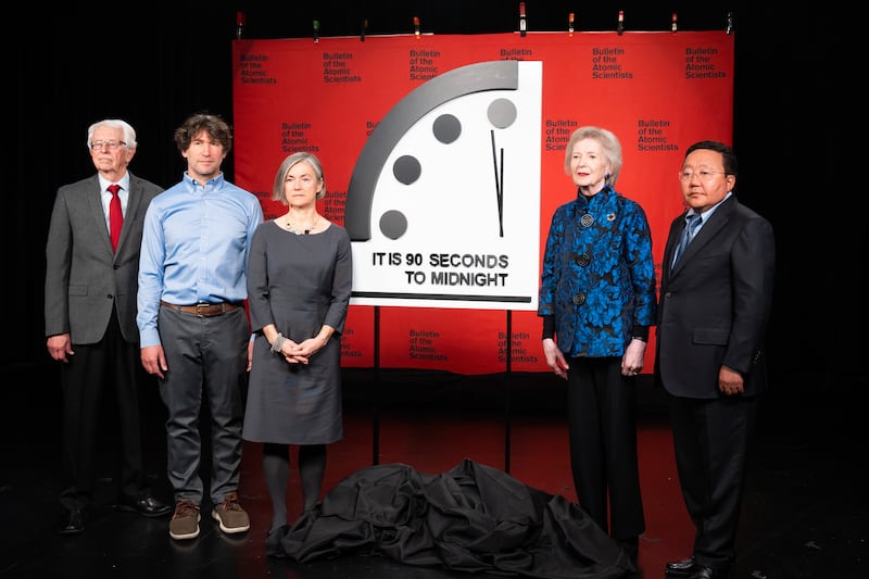 Sigfried Hecker, Daniel Holtz, Sharon Squassoni, Mary Robinson and Tsakhiagiin Elbegdorj move the Doomsday Clock forward in 2023.