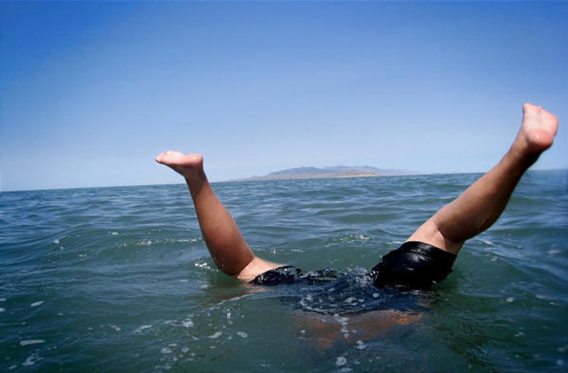 Levi Leiataua of West Jordan does a hand-stand.