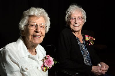 Cousins Carmen Shepard, right, 104, and Mildred Asay, 102, pose for a portrait at the 32nd Centenarian Celebration at the Viridian Event Center in West Jordan on Thursday, Aug. 23, 2018.