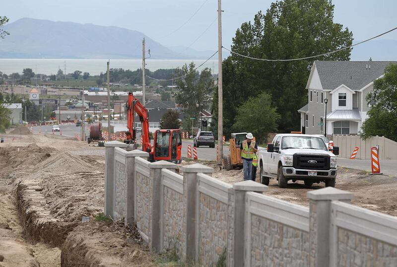 Crews work to widen the road along 900 West and 800 North, June 10, 2015, in American Fork. Early ballot returns in 17 counties indicated mixed results for a local option sales tax increase to fund local transportation projects.