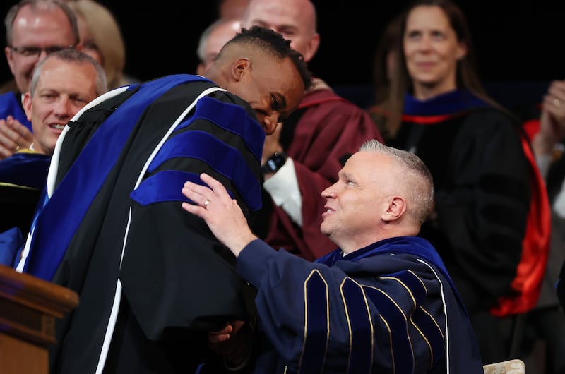 BYU President C. Shane Reese hugs BYU Student Association President Fritz-Carl Morlant on Tuesday, Sept. 19, 2023.