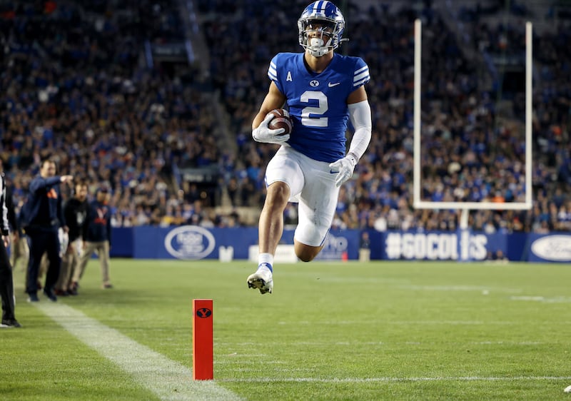 BYU Cougars wide receiver Neil Pau’u (2) scores a touchdown in 2021.