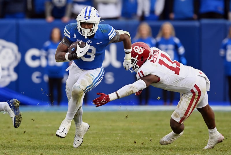 BYU running back Aidan Robbins breaks away for a long run against Oklahoma at LaVell Edwards Stadium on Nov. 18, 2023.