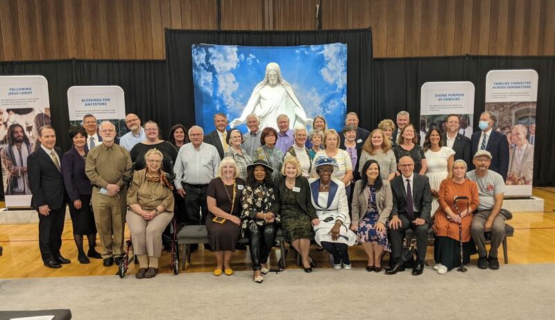 People from different faiths and religions take a photo after touring the Pocatello Idaho Temple.