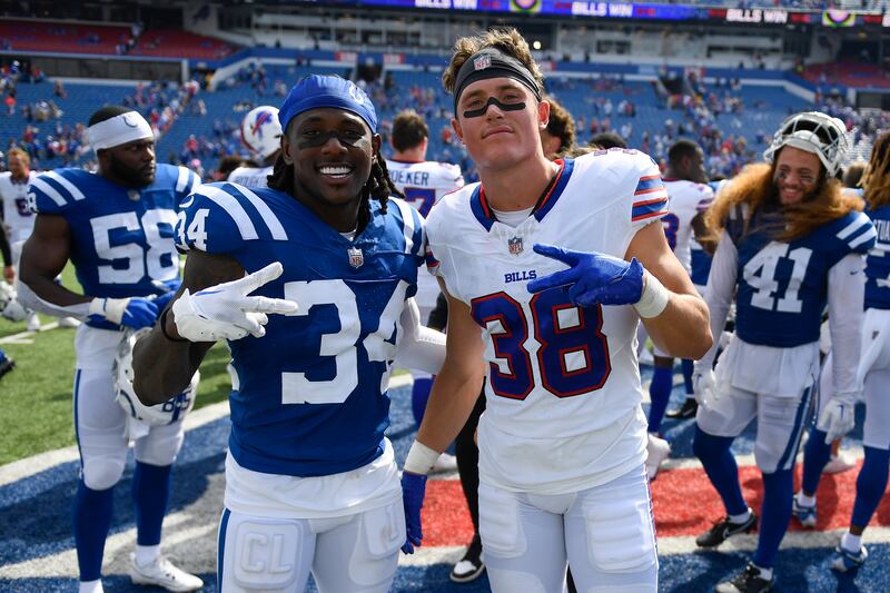 Indianapolis Colts defensive back Chris Lammons, left, and Buffalo Bills safety Zayne Anderson pose for a photo.